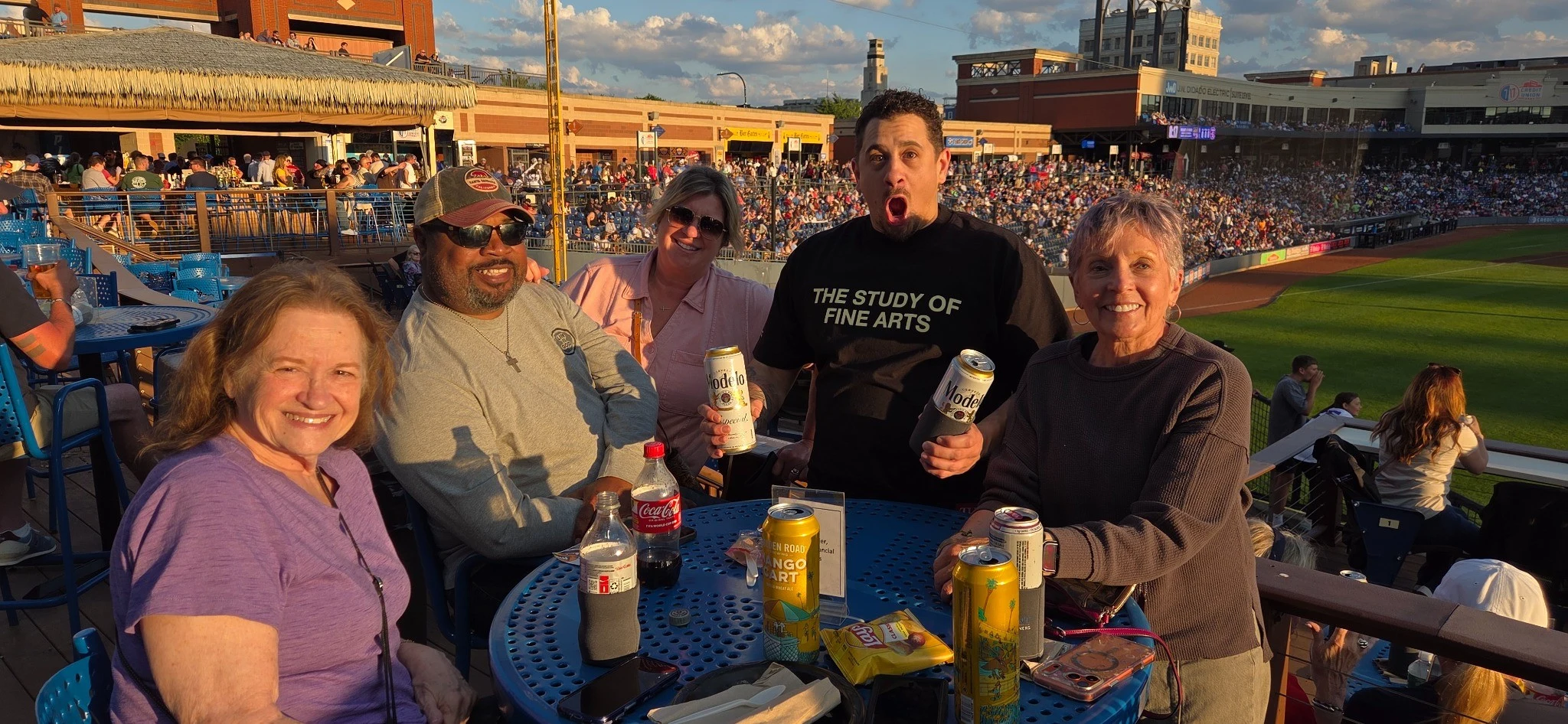 Guests gathered at a table at sunset