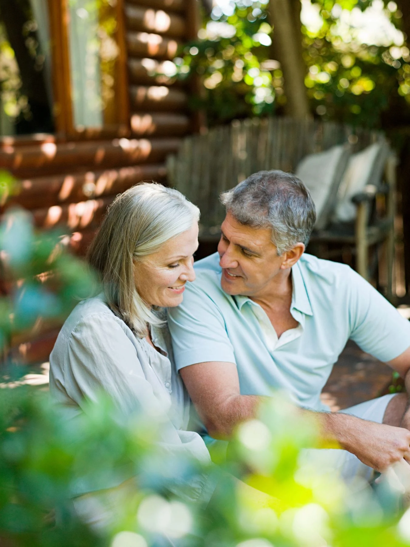 A couple sitting together outdoors