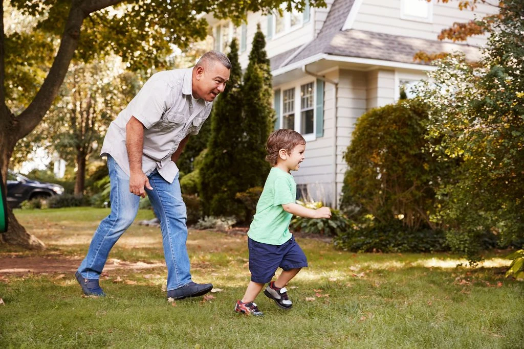 A grandfather and grandson outdoors