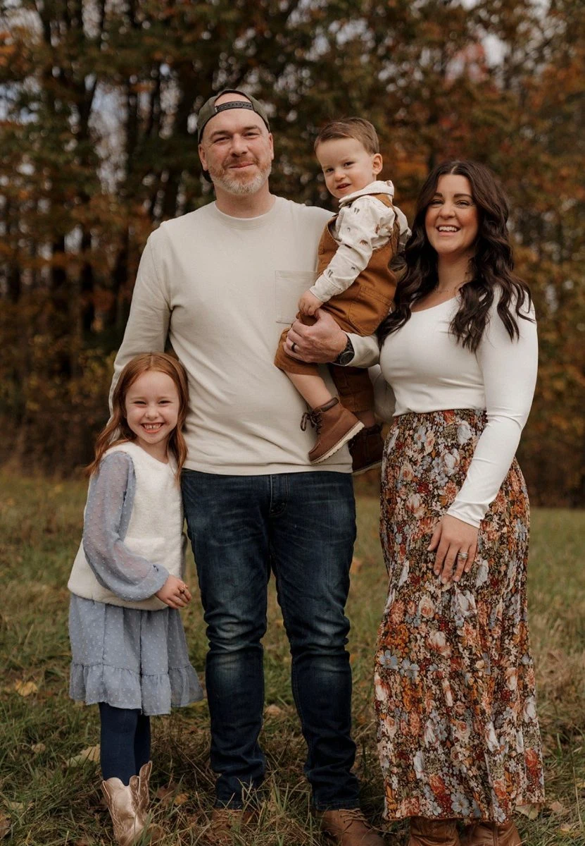 Caitlin Charrier with her family outdoors