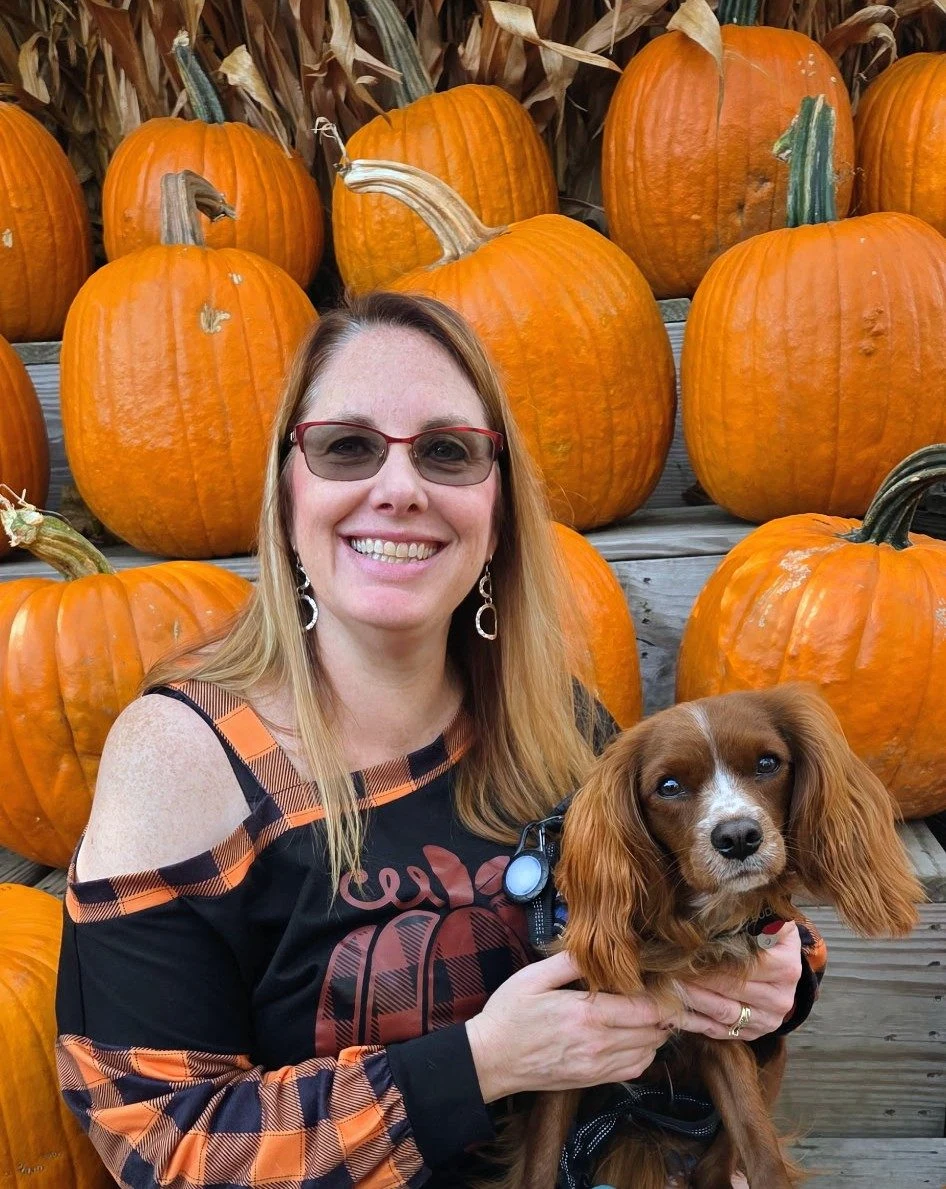 Ellyn Moser at the pumpkin patch with her dog